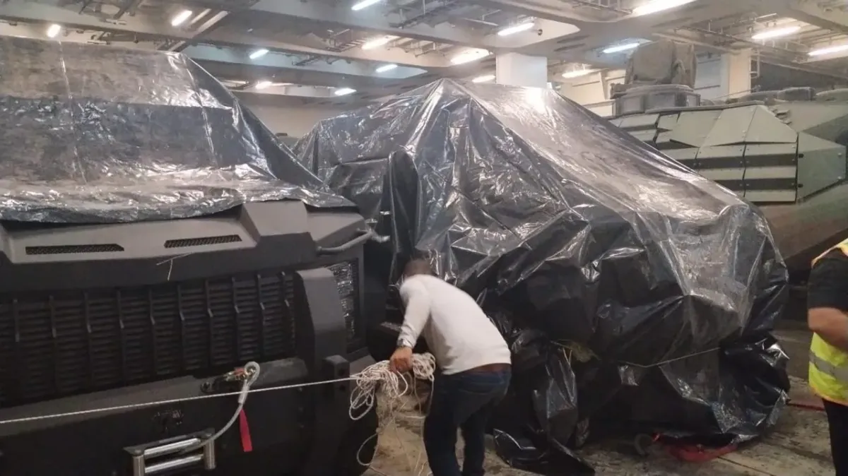 Covered vehicles lashed on a RoRo vessel deck