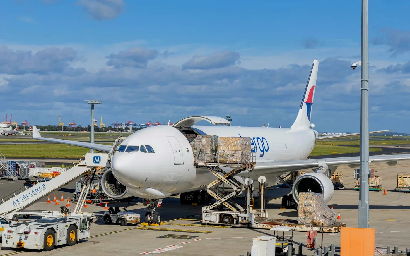 Cargo pallets being loaded onto a freighter aircraft at an airport