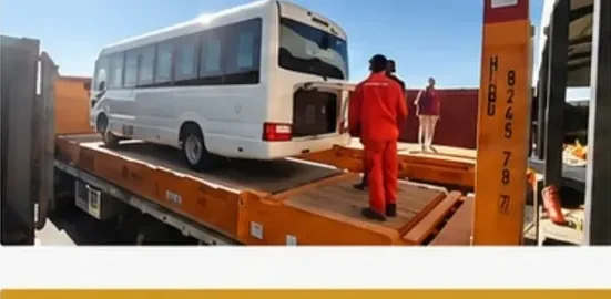 A bus transported on a low-bed trailer