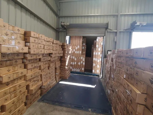 Cartons unloaded from a container into the warehouse
