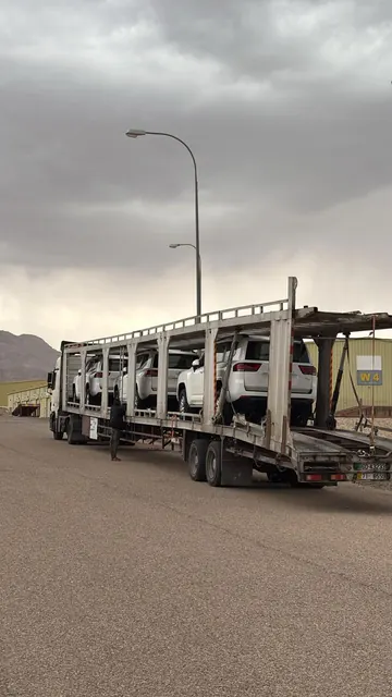 Car carrier loaded with new SUVs leaving the port of Aqaba